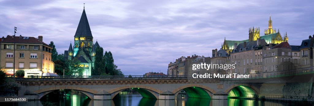 Skyline of Metz on the Moselle River at dusk