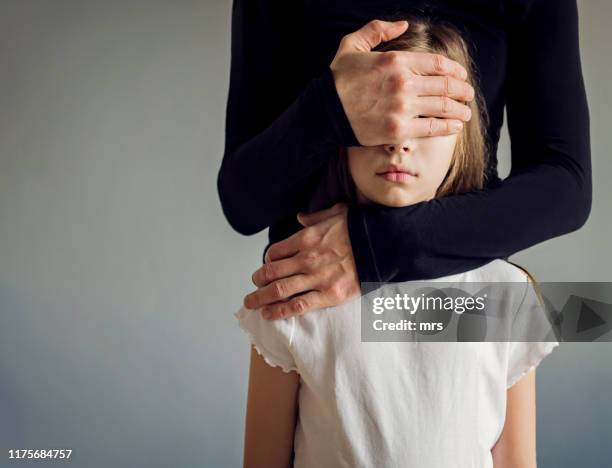 men covering girls eyes - hand covering face stock pictures, royalty-free photos & images