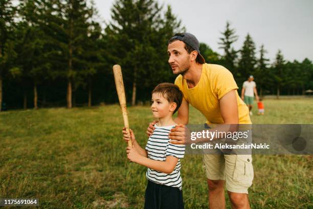 first lessons about baseball - playing baseball stock pictures, royalty-free photos & images