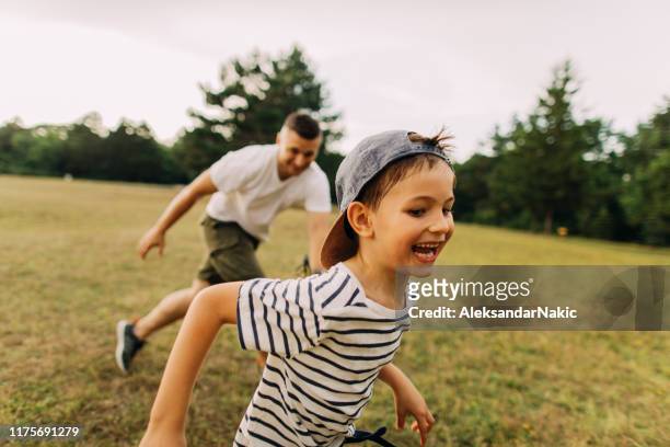 bonding with my dad - kids rugby stock pictures, royalty-free photos & images