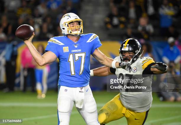 Philip Rivers of the Los Angeles Chargers passes under pressure from Cameron Heyward of the Pittsburgh Steelers in the fourth quarter at Dignity...
