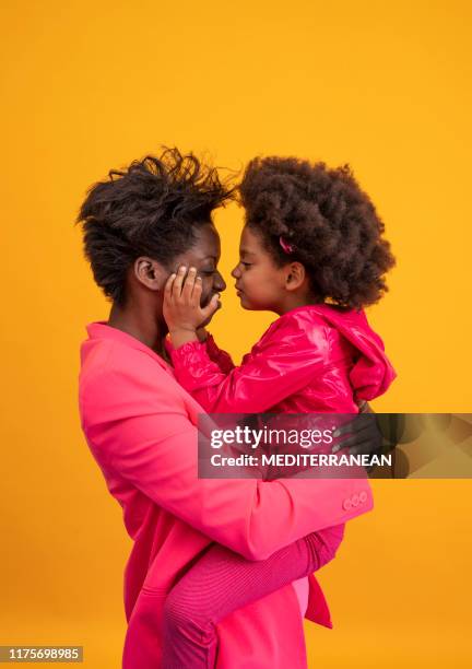 ethnic mother and daughter playful dress in pink - mother and child imagens e fotografias de stock