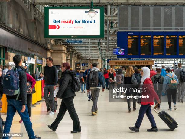 get ready for brexit sign in glasgow central station - brexit travel stock pictures, royalty-free photos & images