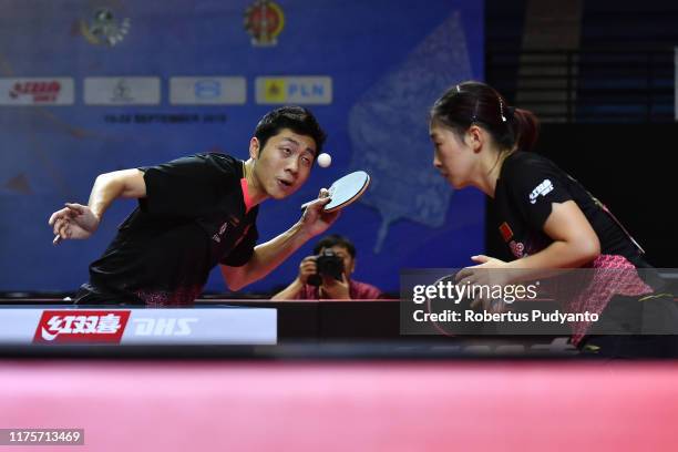 Xu Xin and Liu Shiwen of China compete against Lee Sangsu and Jeon Jihee of South Korea during Mixed Doubles semi-final match on day five of the...