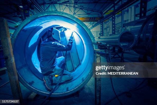 welder man welding stainless steel tank - confined space stock pictures, royalty-free photos & images
