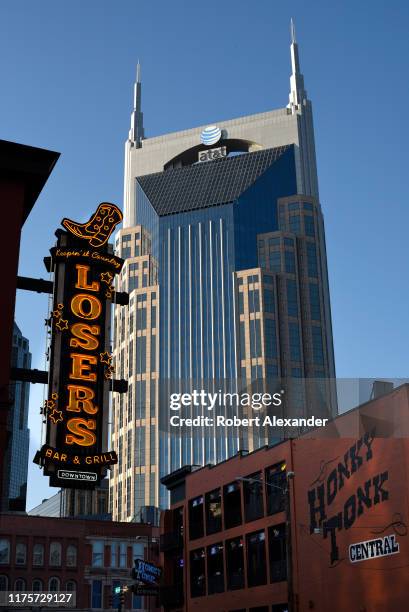 The landmark AT&T Building looms over the Lower Broadway entertainment district in Nashville, Tennessee. The 33-story skyscraper, often referred to...
