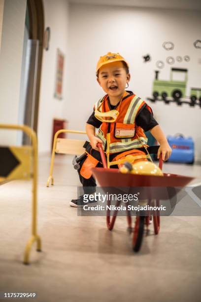 little worker - boy in hard hat stock pictures, royalty-free photos & images