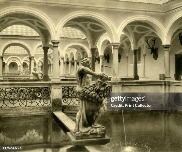 Fish tank sculptures, Kremsmünster Abbey, Upper Austria, circa 1935. Baroque statues decorate fish tanks separated by colonnades at the abbey in the...