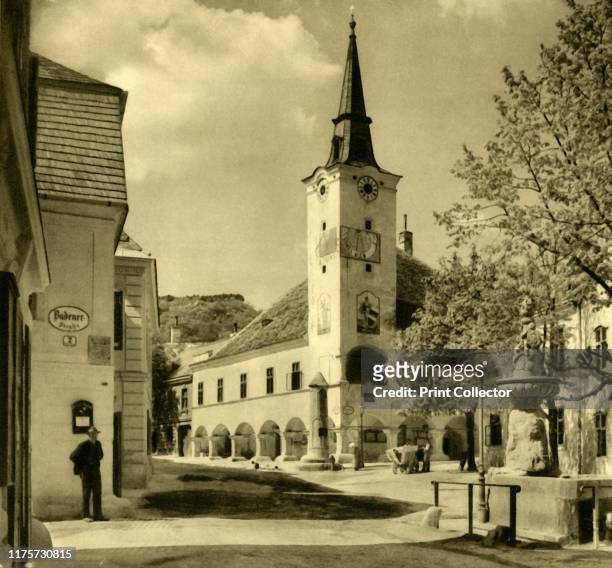 Town hall, Gumpoldskirchen, Mödling, Lower Austria, circa 1935. View of the Rathaus . Pillory and fountain. The town hall, built during the...