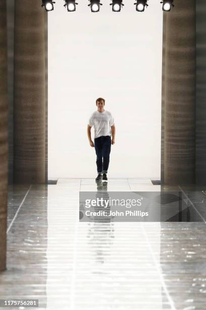 Fashion designer Daniel Lee acknowledges the applause of the audience at the Bottega Veneta show during the Milan Fashion Week Spring/Summer 2020 on...
