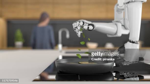 roboterkoch kochen - roboterarm stock-fotos und bilder