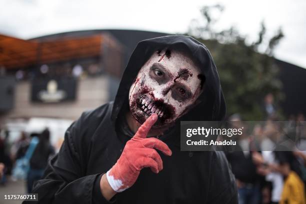 Costumed fan poses inside the Chamber of Commerce of Bogota on SOFÁ on October 13, 2019 in Bogota, Colombia