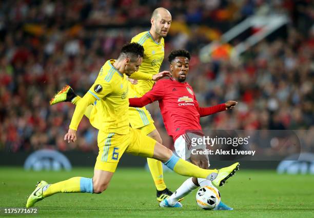 Angel Gomes of Manchester United is challenged by Zarko Tomasevic of Asanta during the UEFA Europa League group L match between Manchester United and...