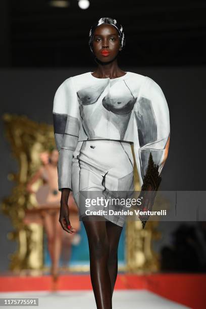 Model walks the runway at the Moschino show during the Milan Fashion Week Spring/Summer 2020 on September 19, 2019 in Milan, Italy.