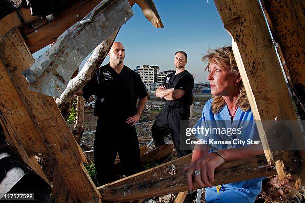 Orthopedic surgeon Dusty Smith, from left, physicianês assistant Chris Jones and nurse Sharell Questelle were all on duty when the tornado hit St....