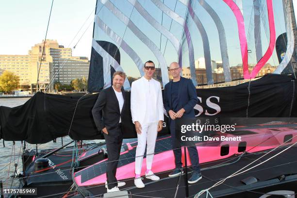 Alex Thomson, Karim Rashid and Mr Langer attend the The 'HUGO BOSS' Boat Christening Ceremony and Cocktail Party on September 19, 2019 in London,...