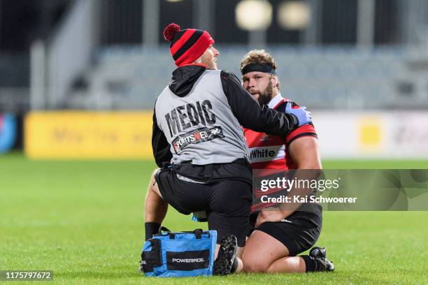 Harry Allan of Canterbury receives medical help during the round 7 Mitre 10 Cup match between Canterbury and Manawatu at Orangetheory Stadium on...