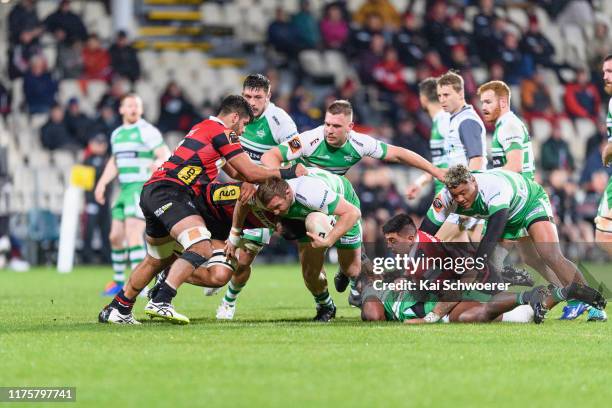 Sam Stewart of Manawatu is tackled by Billy Harmon of Canterbury during the round 7 Mitre 10 Cup match between Canterbury and Manawatu at...