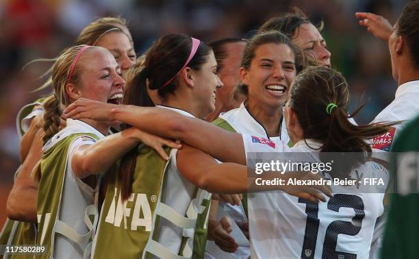 Lauren Cheney of USA celebrates her first goal with teammates during the FIFA Women's World Cup 2011 Group C match between USA and Korea DPR on June...