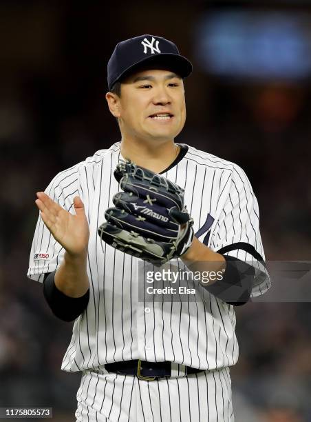 Masahiro Tanaka of the New York Yankees celebrates the final out of the seventh inning against the Los Angeles Angels at Yankee Stadium on September...
