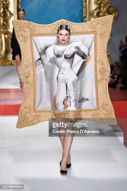 Cara Taylor walks the runway at the Moschino show during the Milan Fashion Week Spring/Summer 2020 on September 19, 2019 in Milan, Italy.