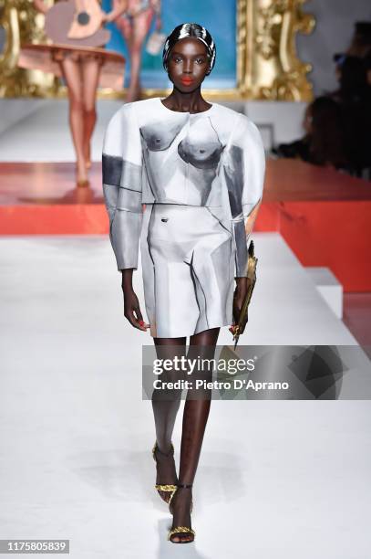 Ajok Madel walks the runway at the Moschino show during the Milan Fashion Week Spring/Summer 2020 on September 19, 2019 in Milan, Italy.