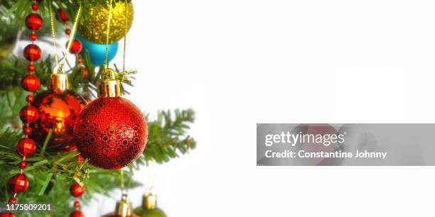 christmas holiday background with hanging decorative ornaments - espumillón fotografías e imágenes de stock