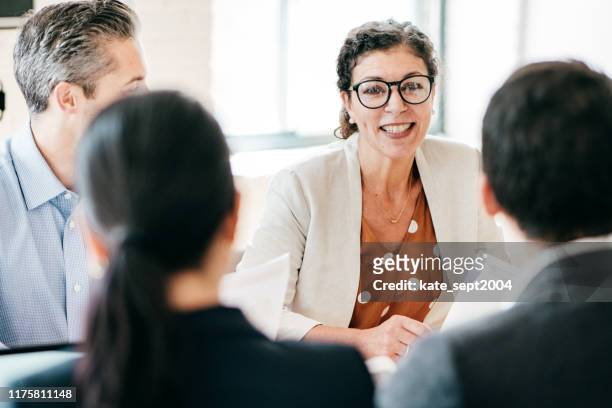 lawyers in a meeting - attending stock pictures, royalty-free photos & images