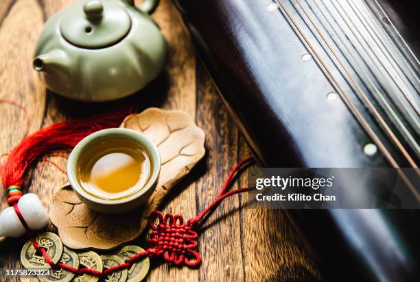 a taste of traditional chinese lifestyle - zither stock pictures, royalty-free photos & images