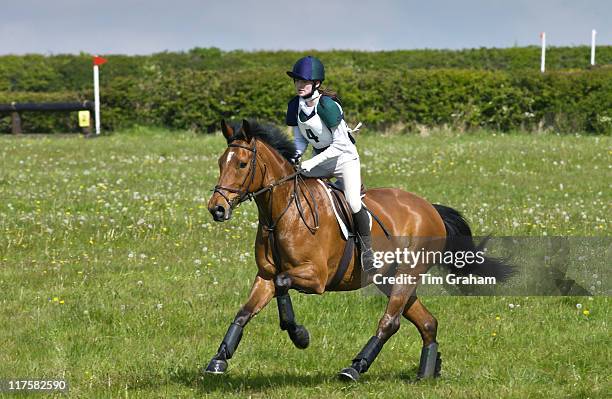 Young girl rides New Forest pony in cross country event in the Cotswolds, Gloucestershire, UK