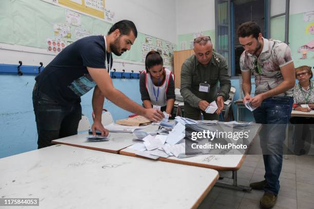 Staff members of the Independent High Authority For The Elections , count ballots of the second round of Tunisia presidential election between...