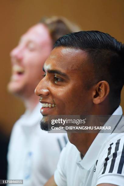 Bangladesh's football captain Jamal Bhuyan and coach Jamie Day react during a press conference on the eve of their World Cup 2022 and the 2023 AFC...