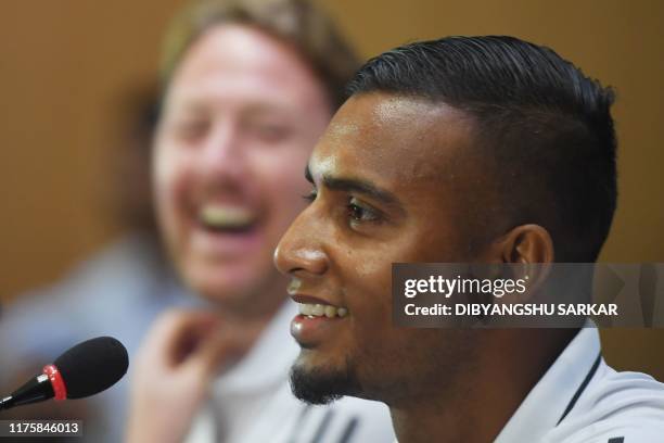 Bangladesh's football captain Jamal Bhuyan and coach Jamie Day react during a press conference on the eve of their World Cup 2022 and the 2023 AFC...