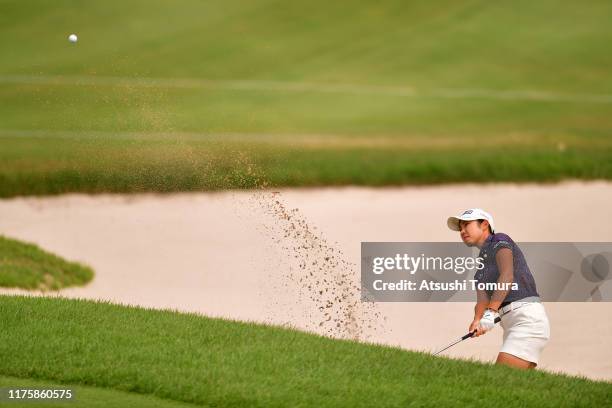 Rie Tsuji of Japan hits out from a bunker on the 1st hole during the first round of the Descente Ladies Tokai Classic at Shin Minami Aichi Country...