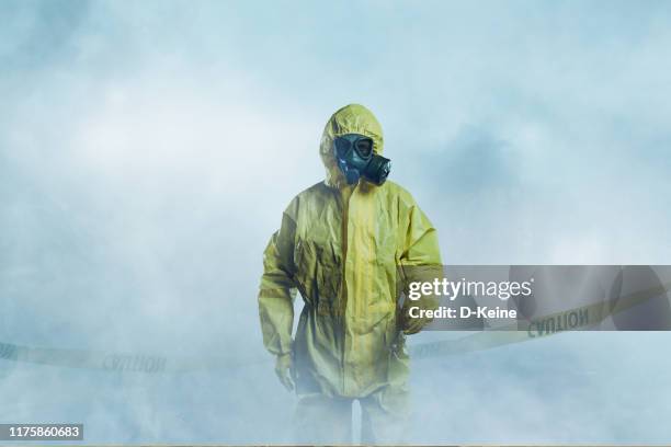 worker in protective suit - protective suit stock pictures, royalty-free photos & images