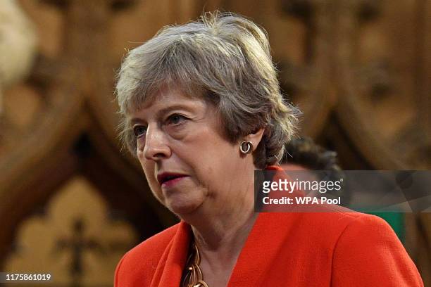 Conservative MP Theresa May walks with Members of Parliament through the Central Lobby toward the House of Lords to listen to the Queen's Speech...