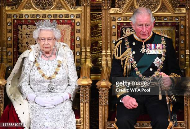 Queen Elizabeth II and Prince Charles, Prince of Wales during the State Opening of Parliament at the Palace of Westminster on October 14, 2019 in...