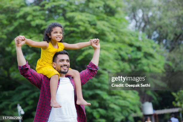 family enjoying summer picnic in the nature stock photo - south india stock pictures, royalty-free photos & images