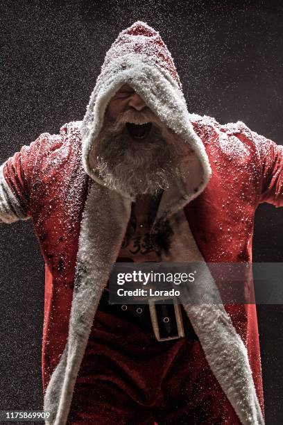 bad santa claus mit pistole - dirty santa stock-fotos und bilder