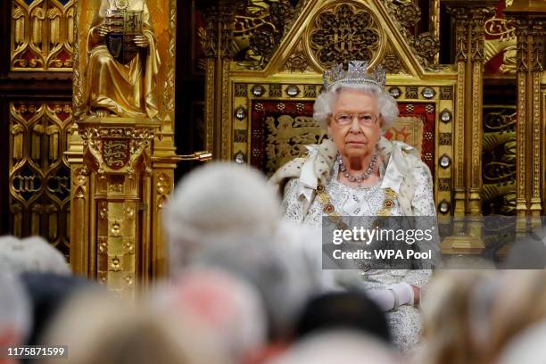 Britain's Queen Elizabeth II sits in The Sovereign's Throne in the House of Lords during the State Opening of Parliament in the Houses of Parliament...