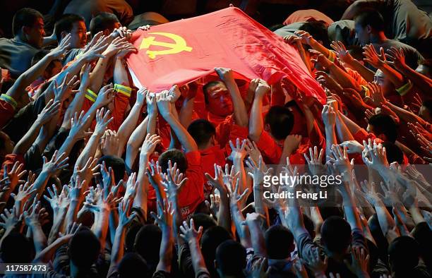 Dancers perform during a gala show to celebrate the 90th anniversary of the founding of the Communist Party of China in the Great Hall of the People...