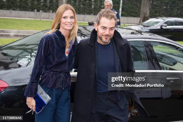 Italian showman Daniele Bossari with his wife Filippa Lagerback, italian swedish-born model and tv host, at Giorgio Armani Fashion Show during Milano...