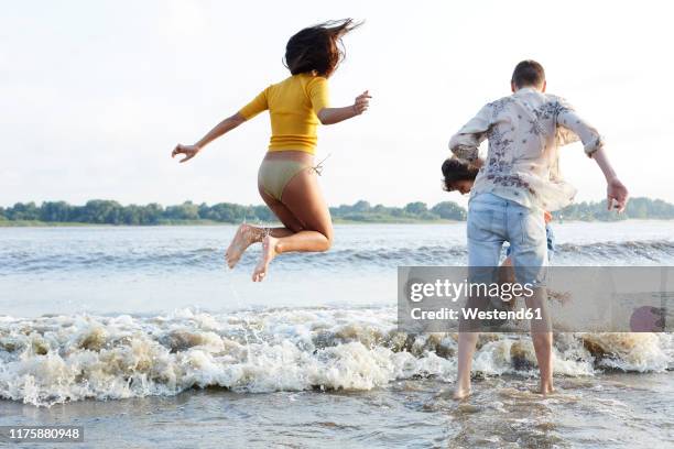 friends having fun at he river - elbe stock-fotos und bilder