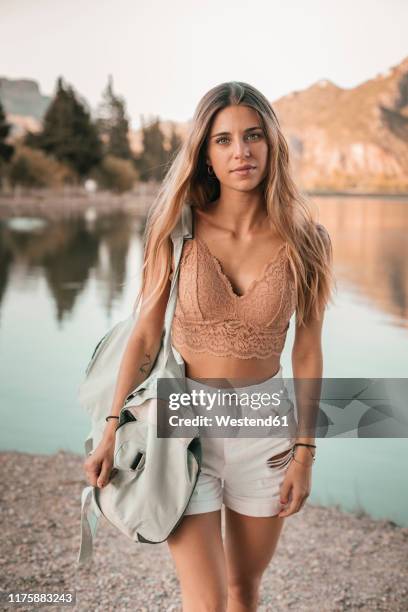 young blond woman at a lake - corset fotografías e imágenes de stock