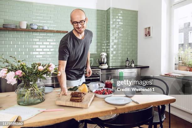 Man Setting The Table Photos and Premium High Res Pictures - Getty Images