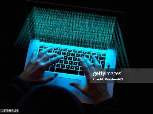 cyber crime, a hacker using a virus to attack software - computer hacking stock-fotos und bilder