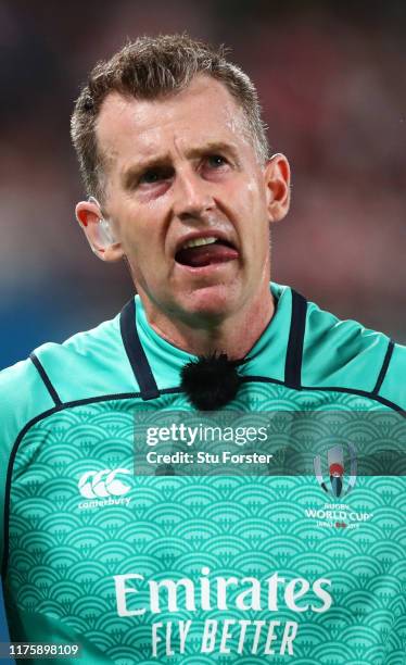 Referee Nigel Owens watches a monitor to decide during the Rugby World Cup 2019 Group A game between Japan and Russia at the Tokyo Stadium on...