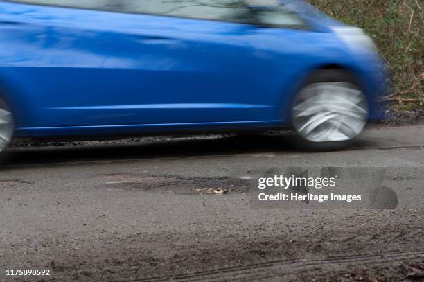 Pot holes in road surface 2017.