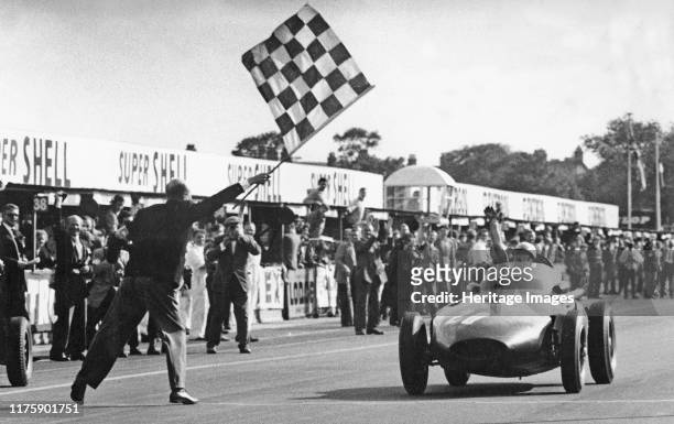 Stirling Moss winning 1957 British Grand Prix at Aintree in the Vanwall.