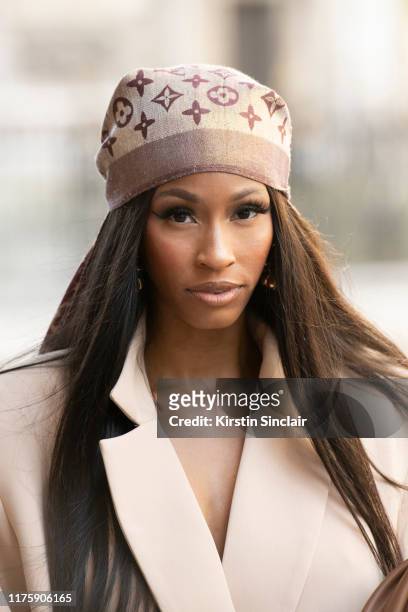 Designer and digital Influencer Rachel Michelle wears a Louis Vuitton scarf and an R.Michel'le the label suit during London Fashion Week September...